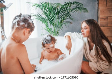 Mother And Son Bathing news anchors