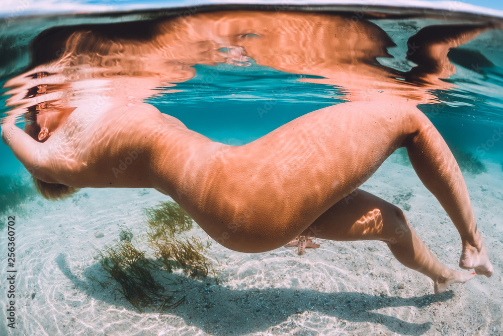 ari novianto recommends nude women swimming underwater pic