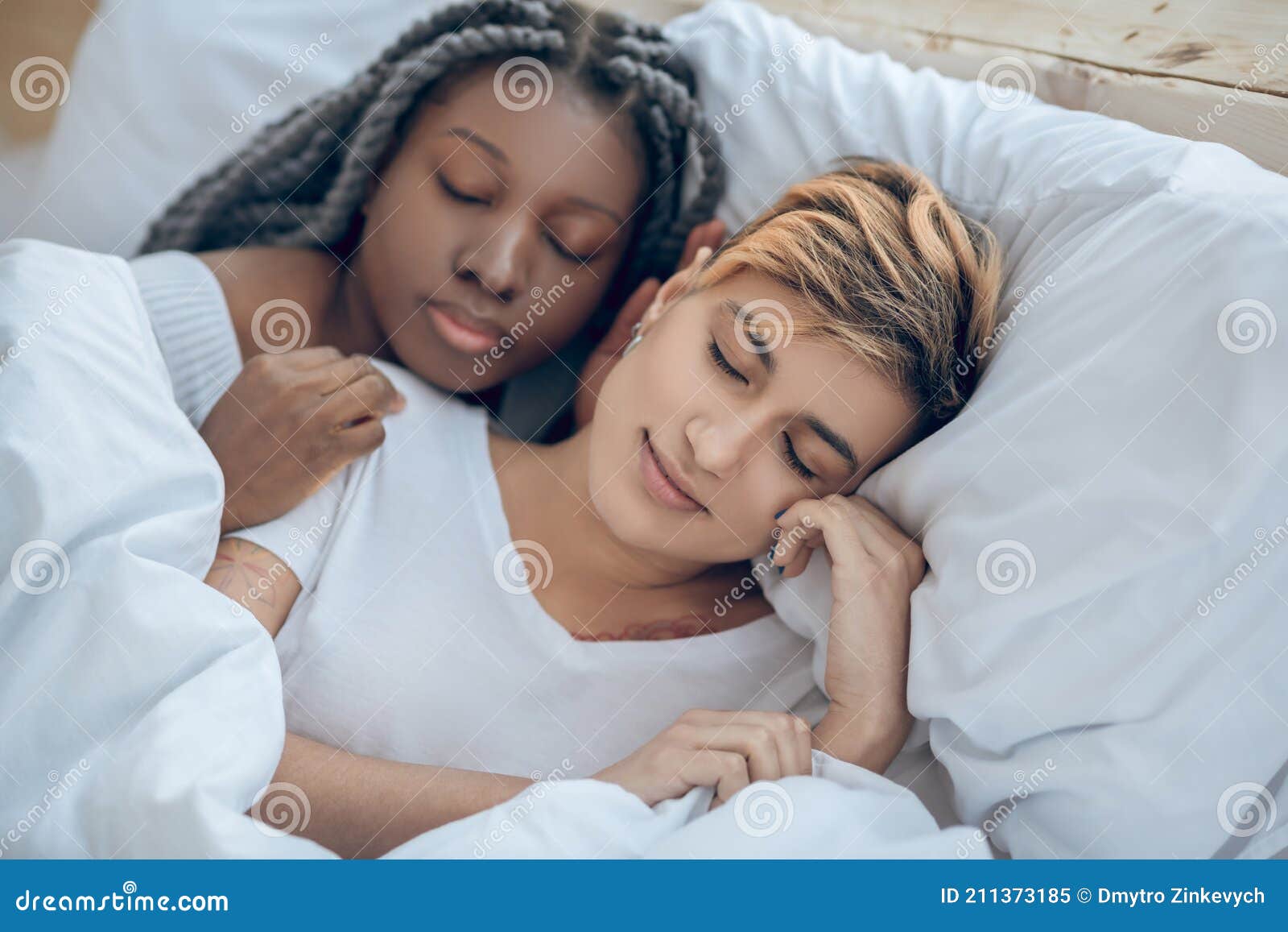 two girls sleeping together