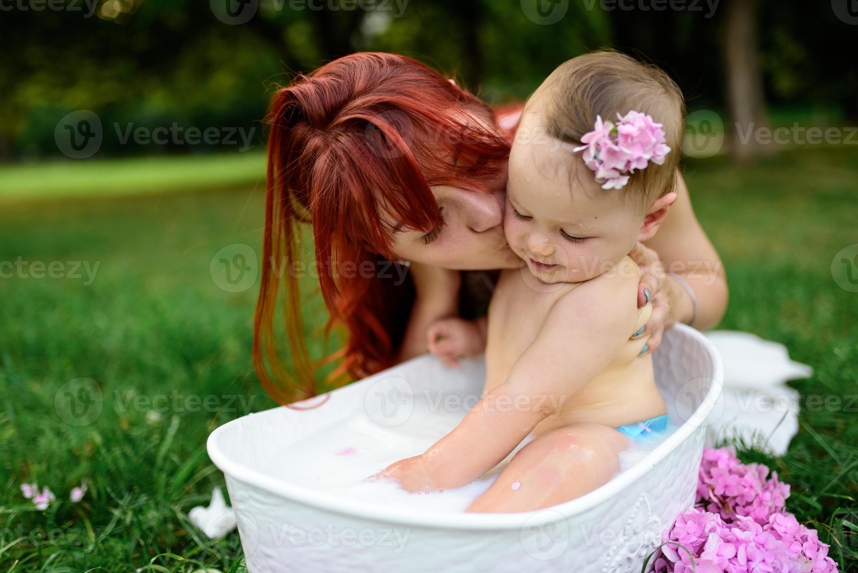 mom helps son bath