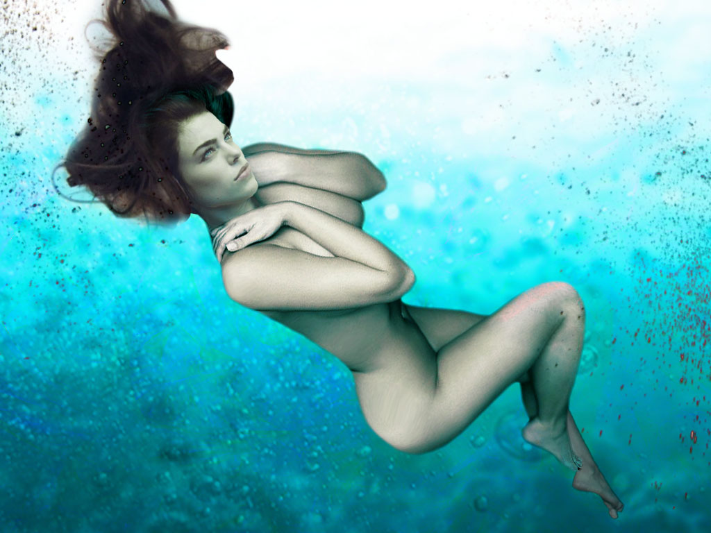 naked women swimming underwater