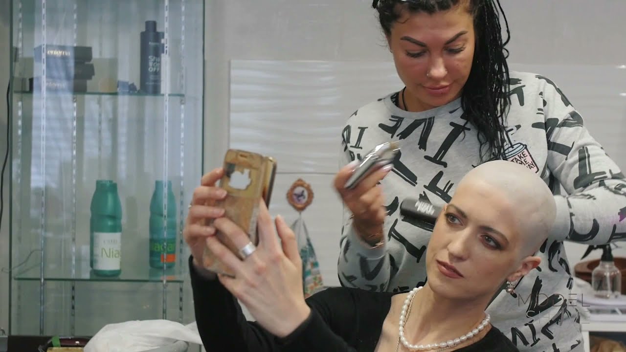 woman headshave in barbershop